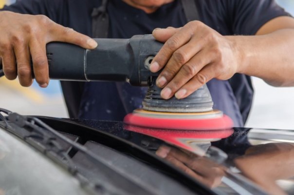 Rupes polisher on a white car